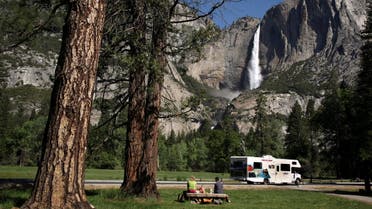 A family has a picnic in view of Upper Yosemite Falls in Yosemite National Park, California May 17, 2009. (File photo: Reuters)