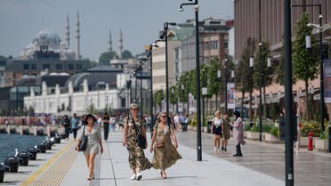 Visitors stroll in Galataport in Istanbul, on June 03, 2022. Galataport, located in Istanbul's neighborhood of Karakoy, is set to energise cruise tourism from the Mediterranean Sea to the Black Sea amidst Turkish economy tailspin over a weakening lira currency and soaring inflation. (AFP)