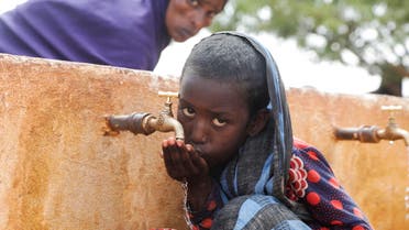 Somali displaced girl Sadia Ali, 8, drinks water from a tap at the Kaxareey camp for the internally displaced people in Dollow, Gedo region of Somalia May 24, 2022. Picture taken May 24, 2022. (File photo: Reuters)