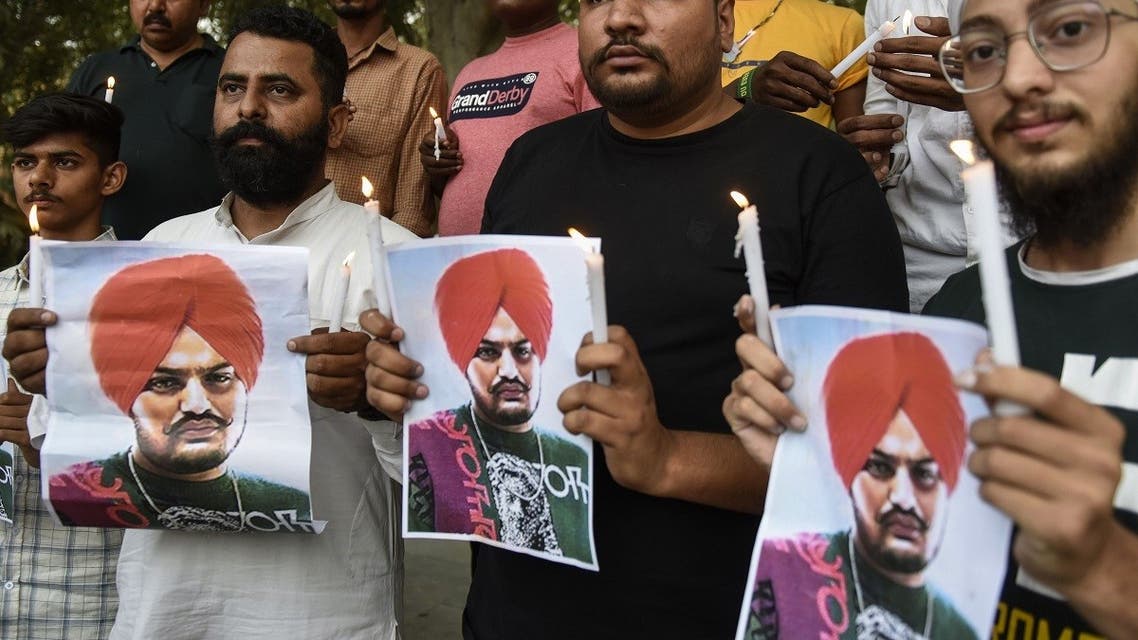 Youth pay tribute to late Punjabi singer Sidhu Moose Wala who was shot dead in Mansa district in India's Punjab state, during a candlelight vigil in Amritsar on May 30, 2022. (AFP)