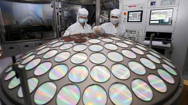 Employees work on the semiconductor chip production line of Jiangsu Azure Corp in Huaian, Jiangsu province, China March 25, 2022. (Reuters)