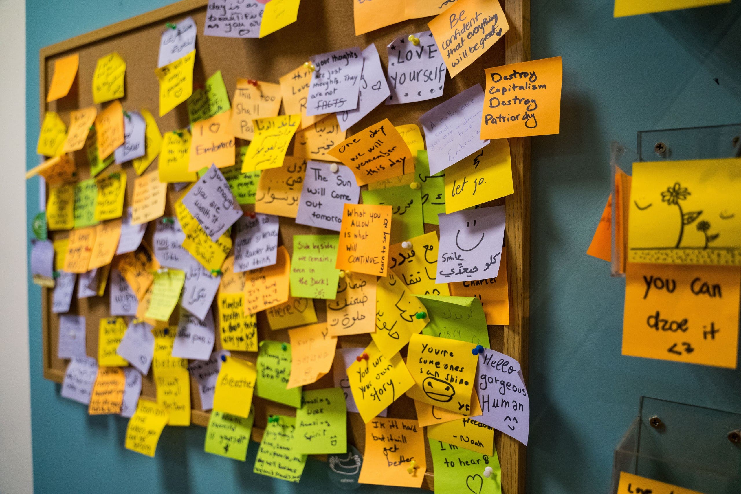 Post-it note board at Embrace Community Mental Health Center where patients and caregivers can leave words of encouragement.  (Photo: Clement Gibon)