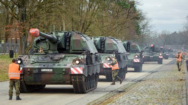 Tanks with mounted howitzers (Panzerhaubitze 2000) of the German armed forces Bundeswehr are driven to the loading area in the Hindenburg barracks in Munster on February 14, 2022. (AFP)