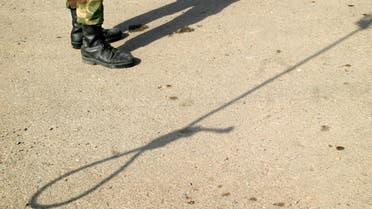 Shadows of an Iranian policeman and a noose are seen on the ground before the execution of Iranian killer Bijeh in Pakdasht, south of Tehran. (Reuters)