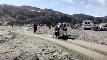 People carry injured to be evacuated following a massive earthquake, in Paktika Province, Afghanistan, June 22, 2022, in this screen grab taken from a video. (Reuters)