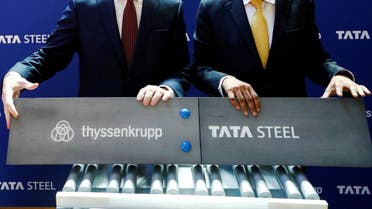 Germany's ThyssenKrupp CEO Heinrich Hiesinger and Chairman of Tata Steel Natarajan Chandrasekaran pose at a joint news conference after signing a final agreement on Saturday to establish a long-expected steel joint venture, in Brussels, Belgium July 2, 2018. (Reuters)