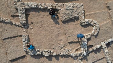 An aerial view shows Palestinian workers of Israel's Antiquities Authority at the recently discovered ancient mosque. (AFP)
