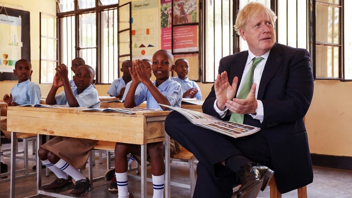 British Prime Minister Boris Johnson attends a lesson during a visit to the GS Kacyiru II school on the sidelines of the Commonwealth Heads of Government Meeting (CHOGM) in Kigali, Rwanda, on June 23, 2022.  (Reuters)