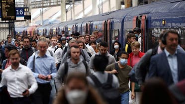 Passengers walk along a platform after disembarking a busy train at Waterloo station, on a day of heavily reduced rail service on the third day of national rail strikes, in London, Britain, on June 23, 2022. (Reuters)