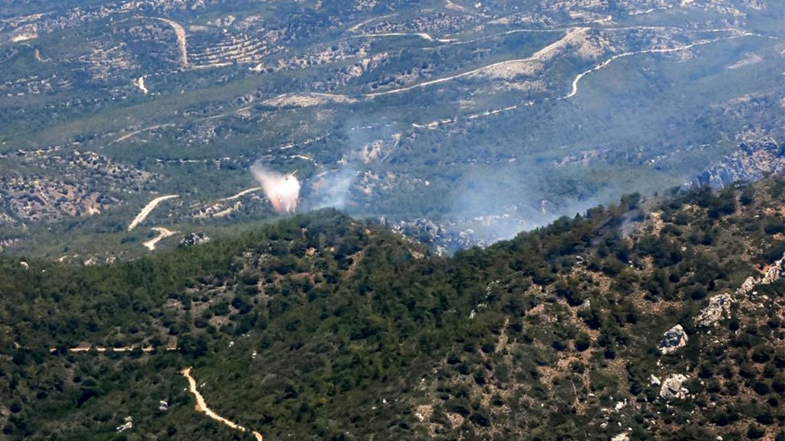 This handout photo provided by the official Twitter account of the presidency of the self-proclaimed Turkish Republic of Northern Cyprus, recognized only by Turkey, on June 23, 2022 shows an aerial view of raging forest fires in the Kyrenia mountains in northern Cyprus. (AFP)