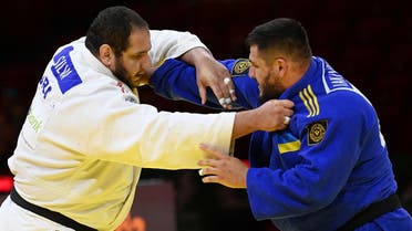 A file photo shows Brazil’s Rafael Silva (white) fights against Ukraine’s Yakiv Khammo (blue) in the quarter-final of the men’s +100kg category during the seventh day of the 2021 Judo World Championships at ‘Papp Laszlo’ Arena of Budapest Hungary on June 12, 2021. (AFP)