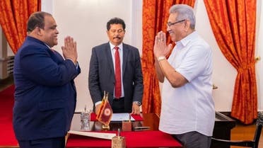 SLPP MP Dhammika Perera (Left) was sworn in as the Minister of Investment Promotion in Sri Lanka, June 24, 2022. (Twitter)