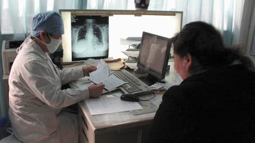 A doctor checks the progress of a patient with tuberculosis at the Beijing Chest Hospital March 31, 2009. (Reuters)