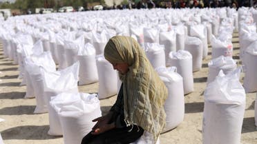 An Afghan girl waits to receive a rice sack, as part of humanitarian aid sent by China to Afghanistan, at a distribution centre in Kabul, Afghanistan, April 7, 2022. (File photo: Reuters)