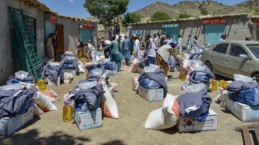 In this picture taken on June 24, 2022, volunteers prepare to distribute relief materials for the earthquake victims in Gayan district, Paktika province, Afghanistan. (AFP)