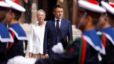 French President Emmanuel Macron and French Prime Minister Elisabeth Borne attend a ceremony marking the 82nd anniversary of late French General Charles de Gaulle’s resistance call of June 18, 1940, at the Mont Valerien memorial in Suresnes near Paris, France, on June 18, 2022. (Reuters)