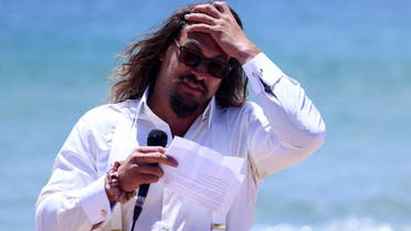 American actor and environmental activist Jason Momoa makes an appearance at a Portuguese Carcavelos beach ahead of the United Nations Ocean Conference in Lisbon, Portugal, June 26, 2022. (Reuters)