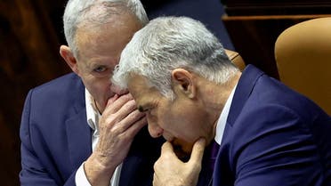 Israeli Defence Minister Benny Gantz and Foreign Minister Yair Lapid attend a preliminary reading at the Israeli parliament, the Knesset, of a bill to dissolve the parliament, in Jerusalem, June 22, 2022. (File photo: Reuters)