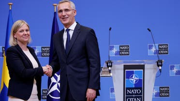 Swedish Prime Minister Magdalena Andersson and NATO Secretary General Jens Stoltenberg shake hands during a news conference ahead of a NATO summit, which is to take place in Madrid, at the alliance's headquarters in Brussels, Belgium June 27, 2022. (File photo: Reuters)
