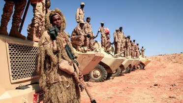 Sudanese soldiers stand next to their vehicles during a military exercise in the Maaqil area in the northern Nile River State, on December 8, 2021. (AFP)