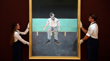 Technicians pose with ‘Study for Portrait of Lucian Freud’ by Francis Bacon which forms part of the upcoming ‘British Art: The Jubilee Auction’ event at Sotheby’s, in London, Britain, June 22, 2022. (Reuters)