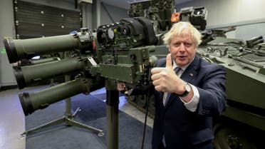 British Prime Minister Boris Johnson gives the thumbs-up next to a Mark 3 shoulder launch LML (Lightweight Multiple Launcher) missile system as he visits Thales weapons manufacturer during a visit to Northern Ireland for talks with Stormont parties, in Belfast, Northern Ireland, May 16, 2022. (Reuters)