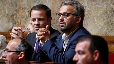 A file photo shows then newly-elected member of parliament Alexis Corbiere (R) of La France Insoumise political party (France Unbowed) attend the opening session of the French National Assembly in Paris, France, June 27, 2017. (Reuters)