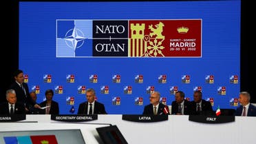 NATO Secretary General Jens Stoltenberg, Lithuanian President Gitanas Nauseda and Latvia's President Egils Levits attend a round table conference during a NATO summit in Madrid, Spain, on June 30, 2022. (Reuters)