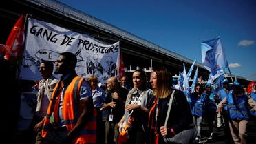 Charles de Gaulle airport employees gather outside the Terminal 2E as they take part in a protest against low wages as inflation hits France, at the Paris-Charles de Gaulle airport in Roissy, near Paris, France, on July 1, 2022. (Reuters)
