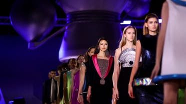 Models present creations during a fashion show to present the latest unpublished models designed by late designer Pierre Cardin and the new collection from the Pierre Cardin design studio, at the National Air and Space Museum in Le Bourget near Paris, after the end of the Paris Spring-Summer 2022 Haute Couture Week, France, January 28, 2022. REUTERS/Violeta Santos Moura