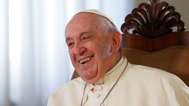 Pope Francis smiles during an exclusive interview with Reuters, at the Vatican, July 2, 2022. (Reuters)