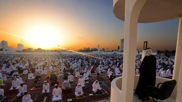 Muslim worshippers listen to the Eid al-Fitr morning prayer sermon at Dubai's Eid Musalla in the Gulf emirate's old port area on May 13, 2021, as Muslims across the golbe mark the end of the holy fasting month of Ramadan. (File photo: AFP)