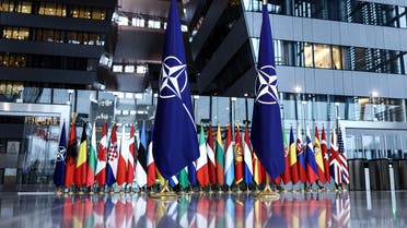A photograph taken on February 16, 2022 shows the flags of the North Atlantic Treaty Organization (NATO) prior to the Meeting of NATO Ministers of Defence at the NATO Headquarter in Brussels. (AFP)