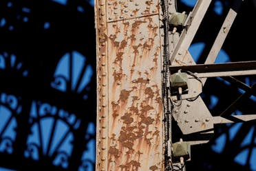 Rust is seen on the Eiffel tower during the 20th campaign of painting and stripping in Paris, France, July 5, 2022. (Reuters)