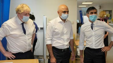 British Prime Minister Boris Johnson, Health Secretary Sajid Javid and Chancellor of the Exchequer Rishi Sunak at the New Queen Elizabeth II Hospital, April 6, 2022. (Reuters)