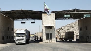 Trucks drive at Bab al-Hawa crossing at the Syrian-Turkish border, in Idlib governorate, Syria, June 30, 2021. Picture taken June 30, 2021. REUTERS/Mahmoud Hassano