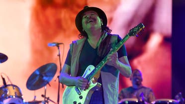 In this file photo taken on March 17, 2019, Mexican born guitar player Carlos Santana performs during the second day of the “Vive Latino” music festival in Mexico City. (AFP)