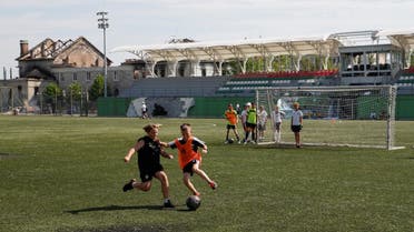 Young players of the Olymp football club attend a training session at the Central stadium in the Irpin town, which was heavily damaged during Russia’s invasion of Ukraine, outside of Kyiv, July 6, 2022. (Reuters)