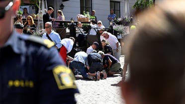 First responders work at the scene after a woman was seriously injured in a stabbing at the Almedalen political festival at Visby, on Gotland island, Sweden July 6, 2022. (Reuters)