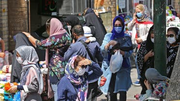 Iranian women, wearing protective masks due to the COVID-19 pandemic, shop in the capital Tehran on August 4, 2020. (AFP)