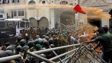 Police use water canon to disperse farmers taking part in an anti-government protest demanding the resignation of Sri Lanka's President Gotabaya Rajapaksa over the country's ongoing economic crisis in Colombo on July 6, 2022. (AFP)