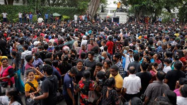 People wait to visit the President's house on the day after demonstrators entered the building, after President Gotabaya Rajapaksa fled, amid the country's economic crisis, in Colombo, Sri Lanka July 10, 2022. REUTERS/Dinuka Liyanawatte