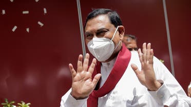 Basil Rajapaksa, one of the brothers of Sri Lanka's president Gotabaya Rajapaksa, gestures as he leaves after he announced that he had resigned from parliament, amid the country's economic crisis, in Colombo, Sri Lanka, on June 9, 2022. (Reuters)