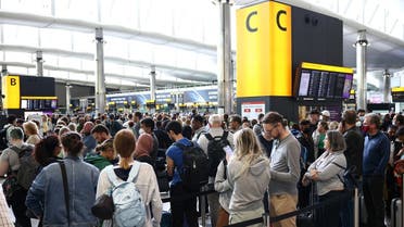 Passengers queue inside the departures terminal of Terminal 2 at Heathrow Airport in London, Britain, on June 27, 2022. (Reuters)