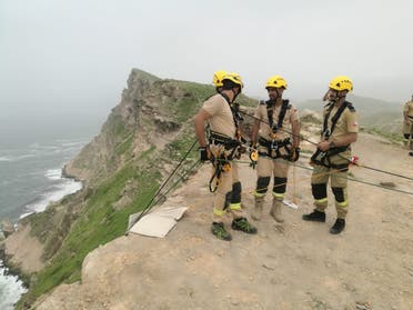 Oman's national search and rescue team look for members of the missing family who were swept away at Mughsail beach. (Twitter)
