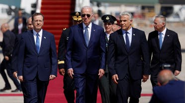 Israeli Prime Minister Yair Lapid and President Isaac Herzog welcome U.S. President Joe Biden as he lands for a three-day visit, at Ben Gurion International Airport in Lod near Tel Aviv, Israel, July 13, 2022. (Reuters)