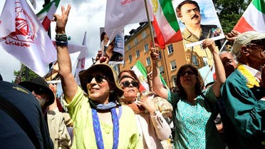 People react to the verdict of the trial of Hamid Noury, a former Iranian prosecution official accused of crimes against international law and murder in Iran in 1988, outside the Stockholm District Court in Stockholm, Sweden July 14, 2022. (Chris Anderson/TT News Agency/via Reuters)