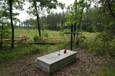 A symbolic grave in the Bialucki Forest near Ilowo on July 13, 2022 the site where the mass grave of about 8,000 Geman Nazi victims from the nearby Soldau concentration camp in Dzialdowo was unearthed at the beginning of July 2022. (AFP)
