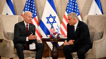 US President Joe Biden (L) holds a bilateral meeting with Israel's Prime Minister Yair Lapid at a hotel in Jerusalem on July 14, 2022. (AFP)