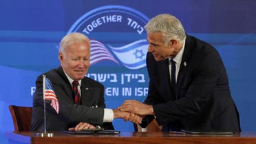 President Joe Biden and Israeli Prime Minister Yair Lapid attend the first virtual meeting of the I2U2 group with leaders of India and the United Arab Emirates, in Jerusalem, July 14, 2022. (Reuters)